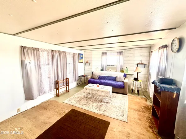 a view of a patio with table and chairs