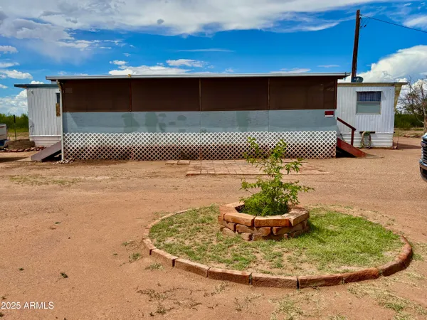a view of a house with a yard and garage
