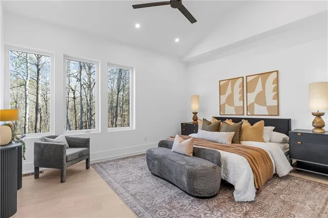 a bedroom with furniture and a window