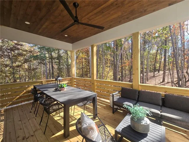 a view of a dining room with furniture window and outside view