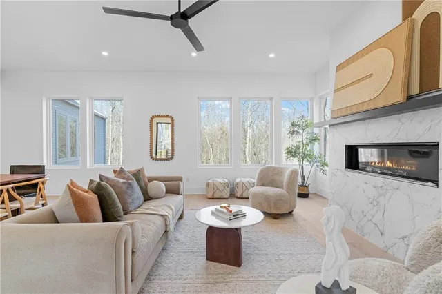 a living room with stainless steel appliances kitchen island granite countertop furniture and a kitchen view