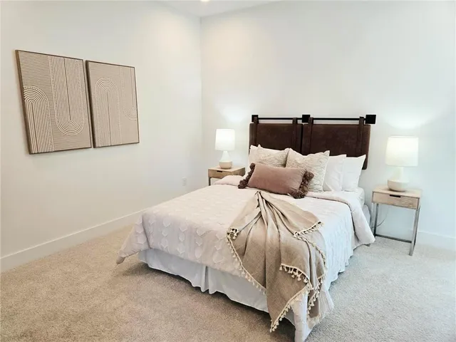 a bedroom with a bed and a chair