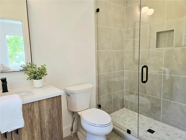 a bedroom with a bed and a lamp on table