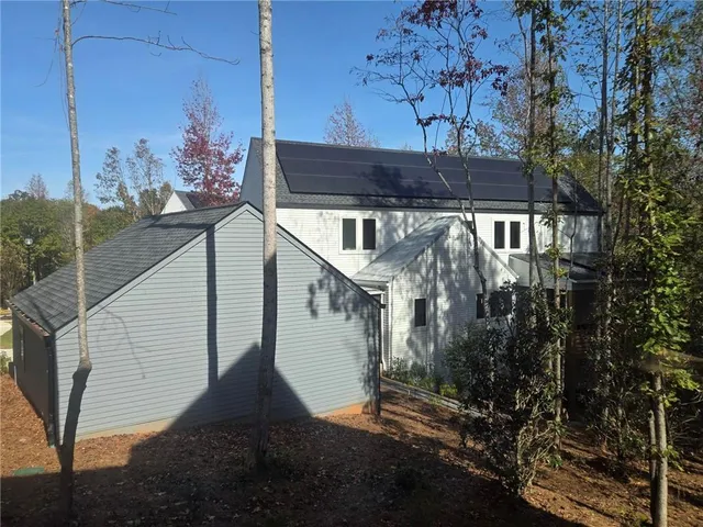 a view of balcony with wooden floor and fence