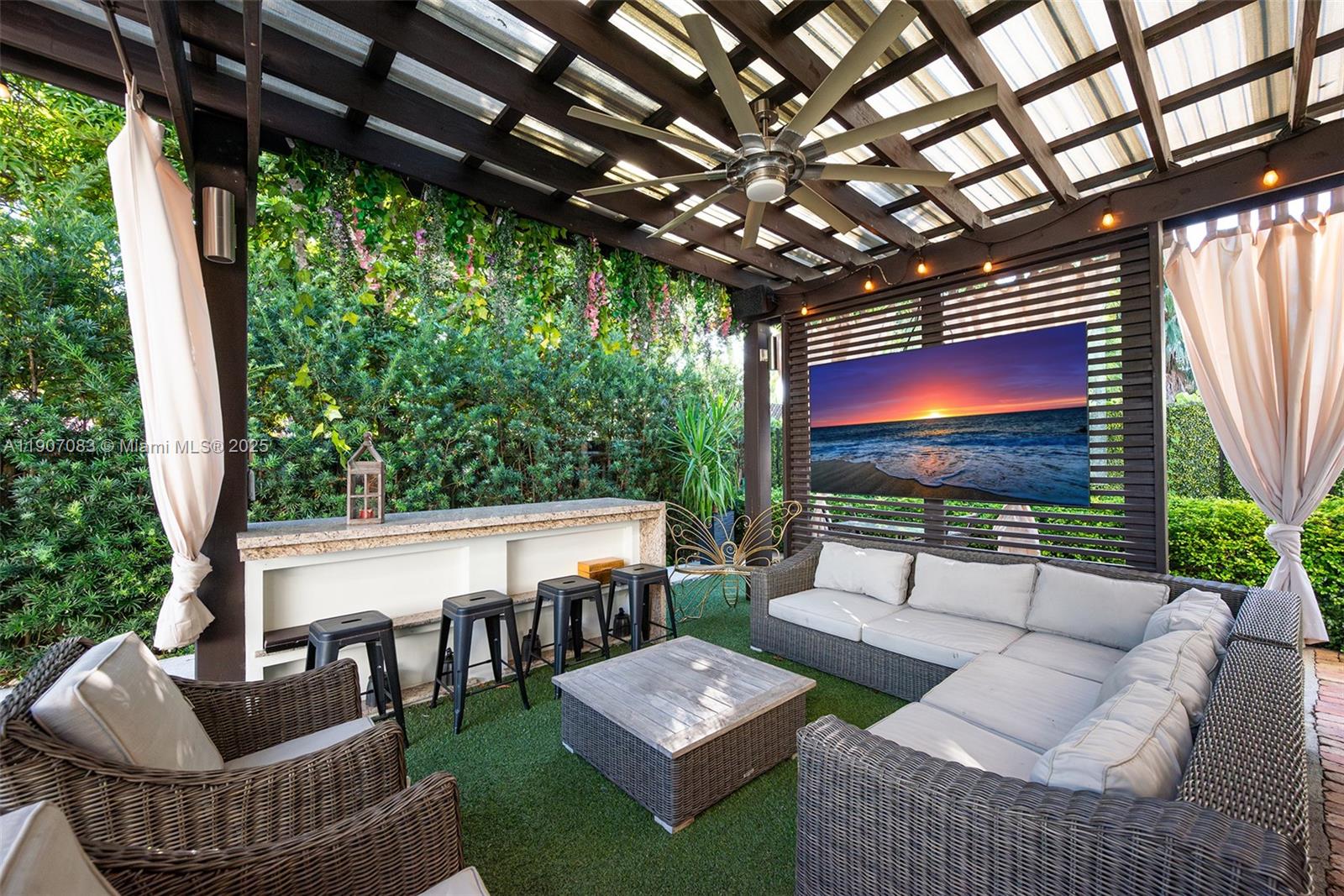 8025 Southwest 91 Avenue Miami, FL 33173 - Photo 11 of 51 a outdoor living space with furniture and a rug
