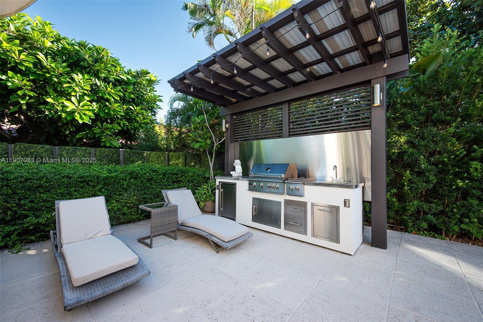 8025 Southwest 91 Avenue Miami, FL 33173 - Photo 12 of 51 a view of house with backyard outdoor seating and green space