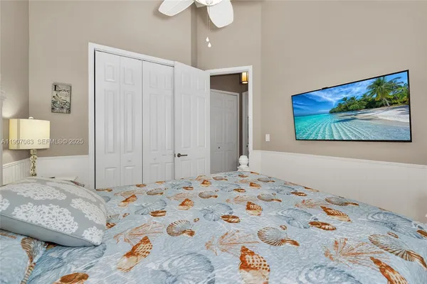 a bathroom with a shower sink vanity and toilet