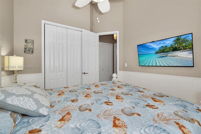 a bathroom with a shower sink vanity and toilet