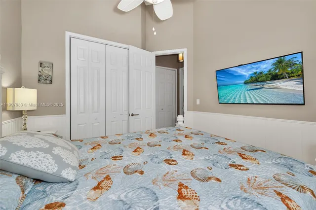a bathroom with a shower sink vanity and toilet