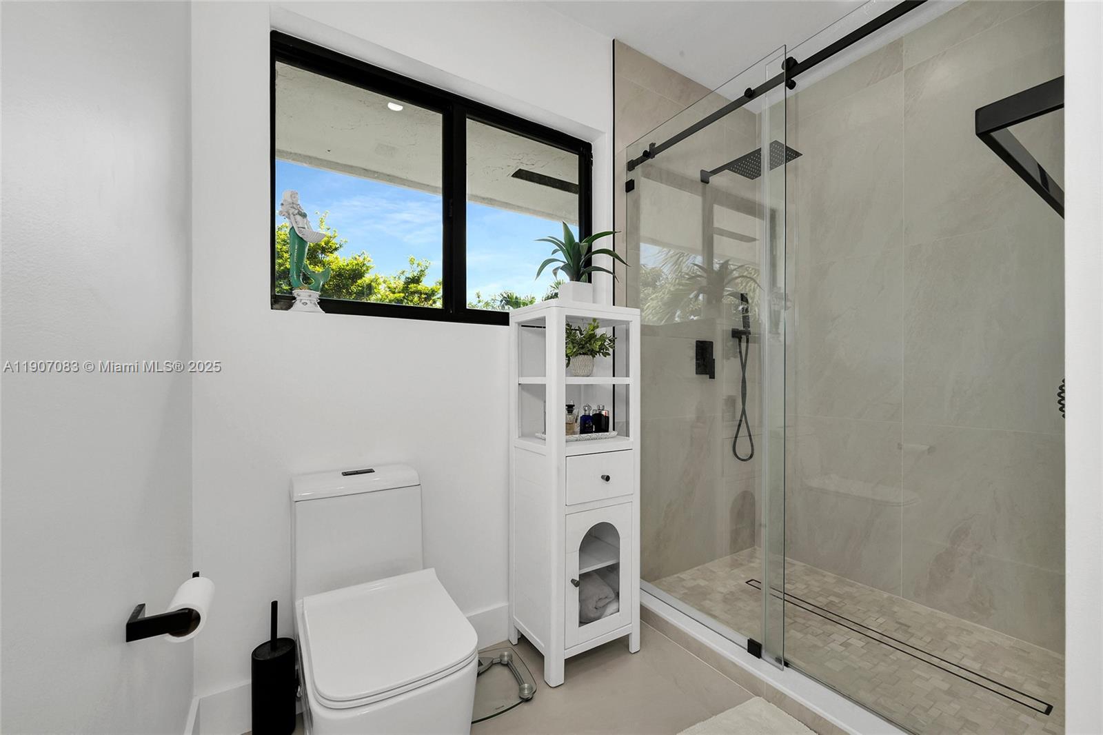 8025 Southwest 91 Avenue Miami, FL 33173 - Photo 34 of 51 a bathroom with a shower and a toilet