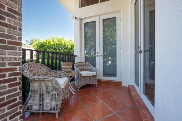 a view of balcony with furniture