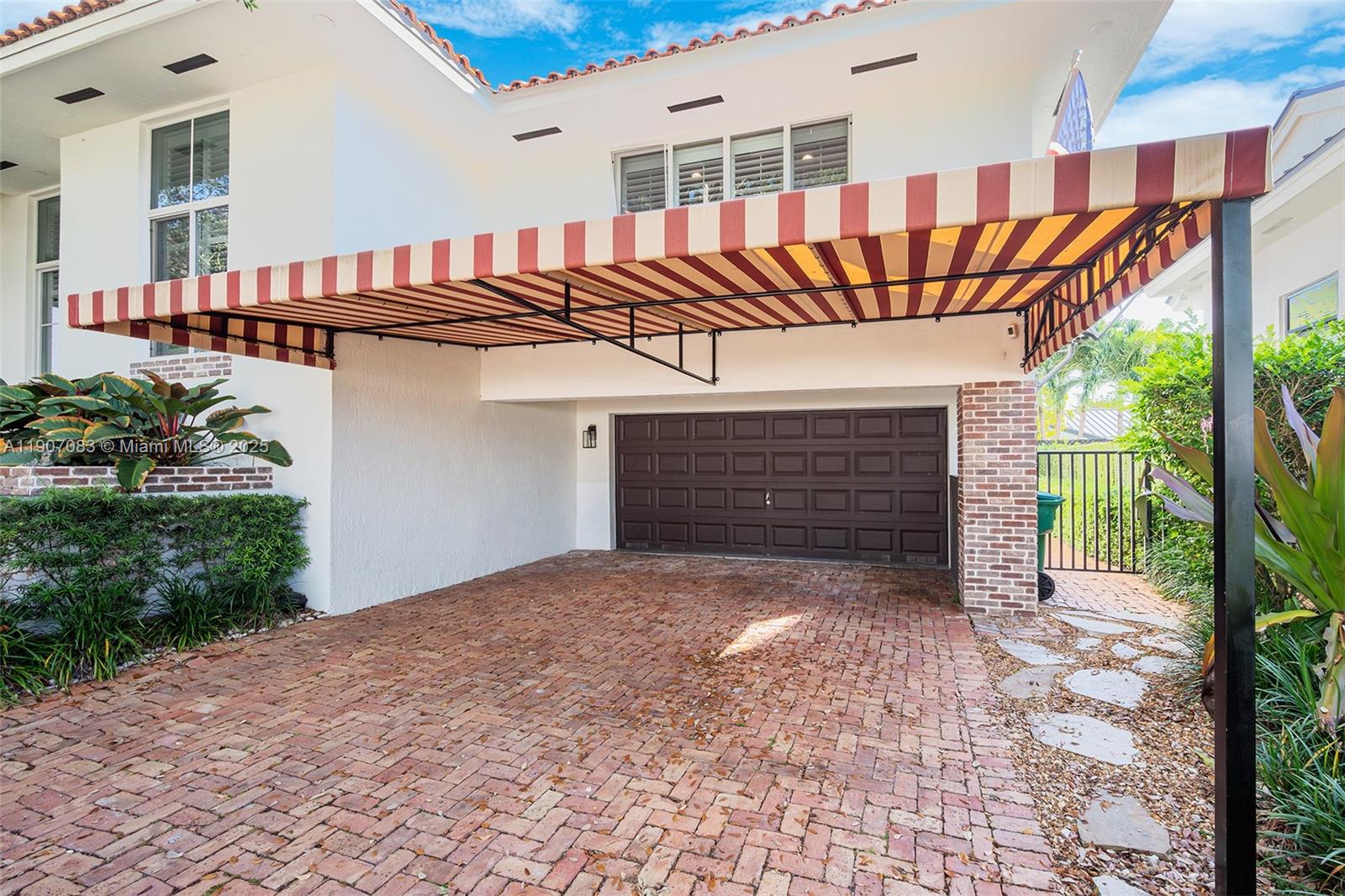 8025 Southwest 91 Avenue Miami, FL 33173 - Photo 4 of 51 a front view of a house with a yard and garage