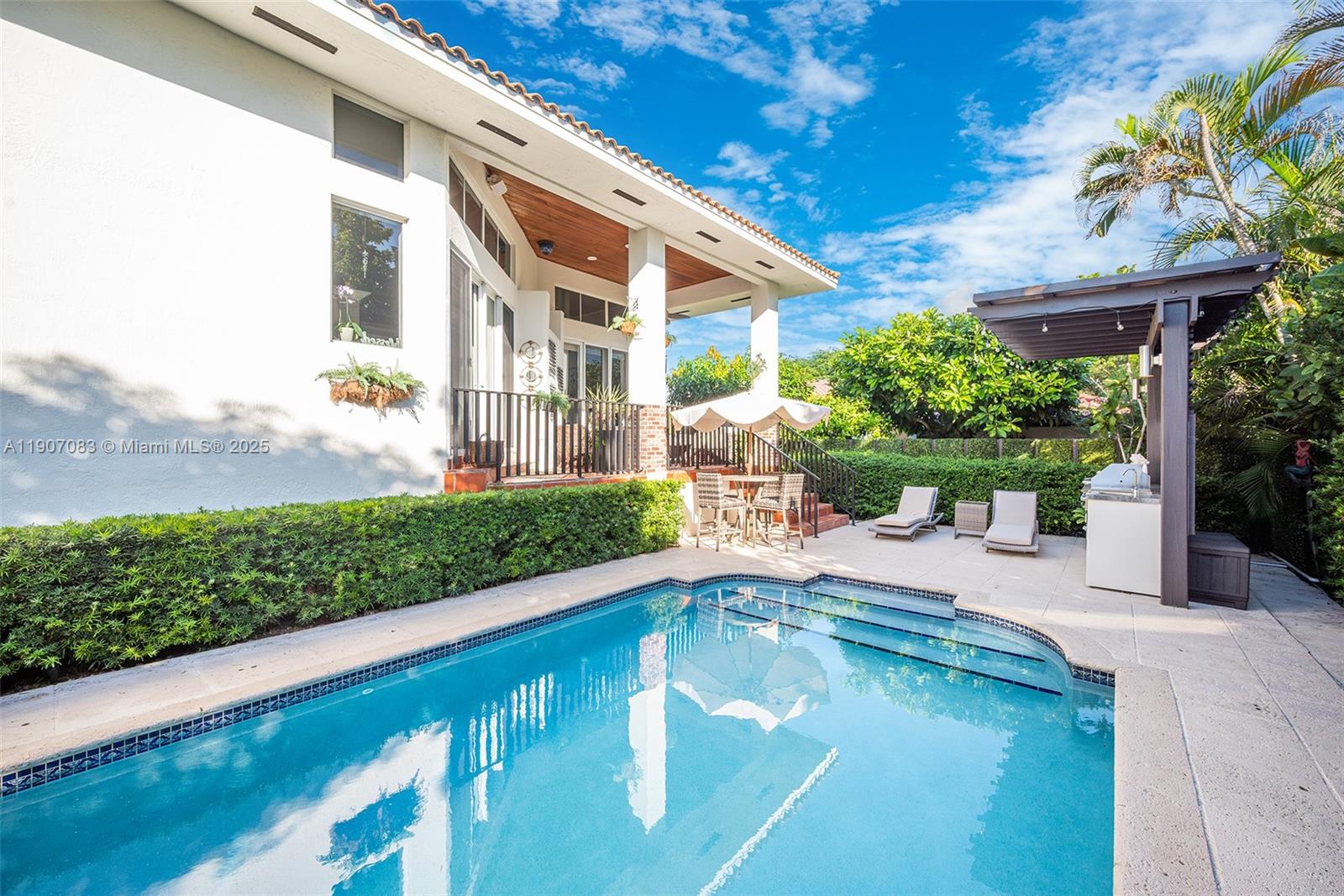 8025 Southwest 91 Avenue Miami, FL 33173 - Photo 41 of 51 a view of a swimming pool with a patio