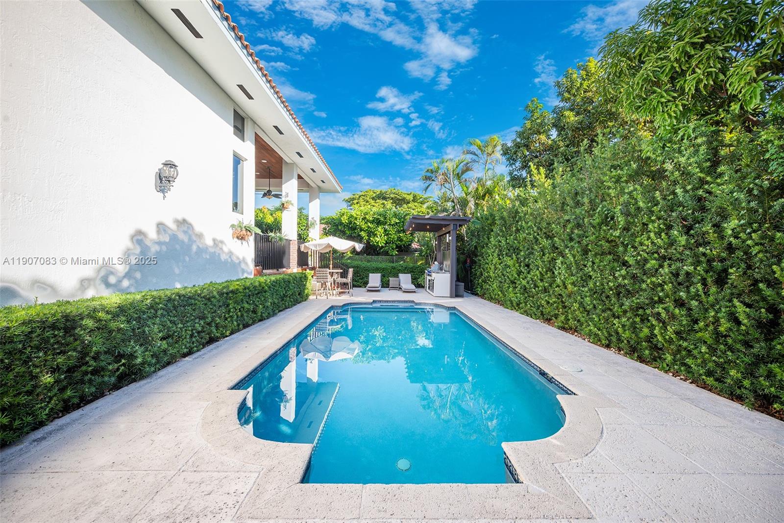 8025 Southwest 91 Avenue Miami, FL 33173 - Photo 43 of 51 a view of a swimming pool with a yard