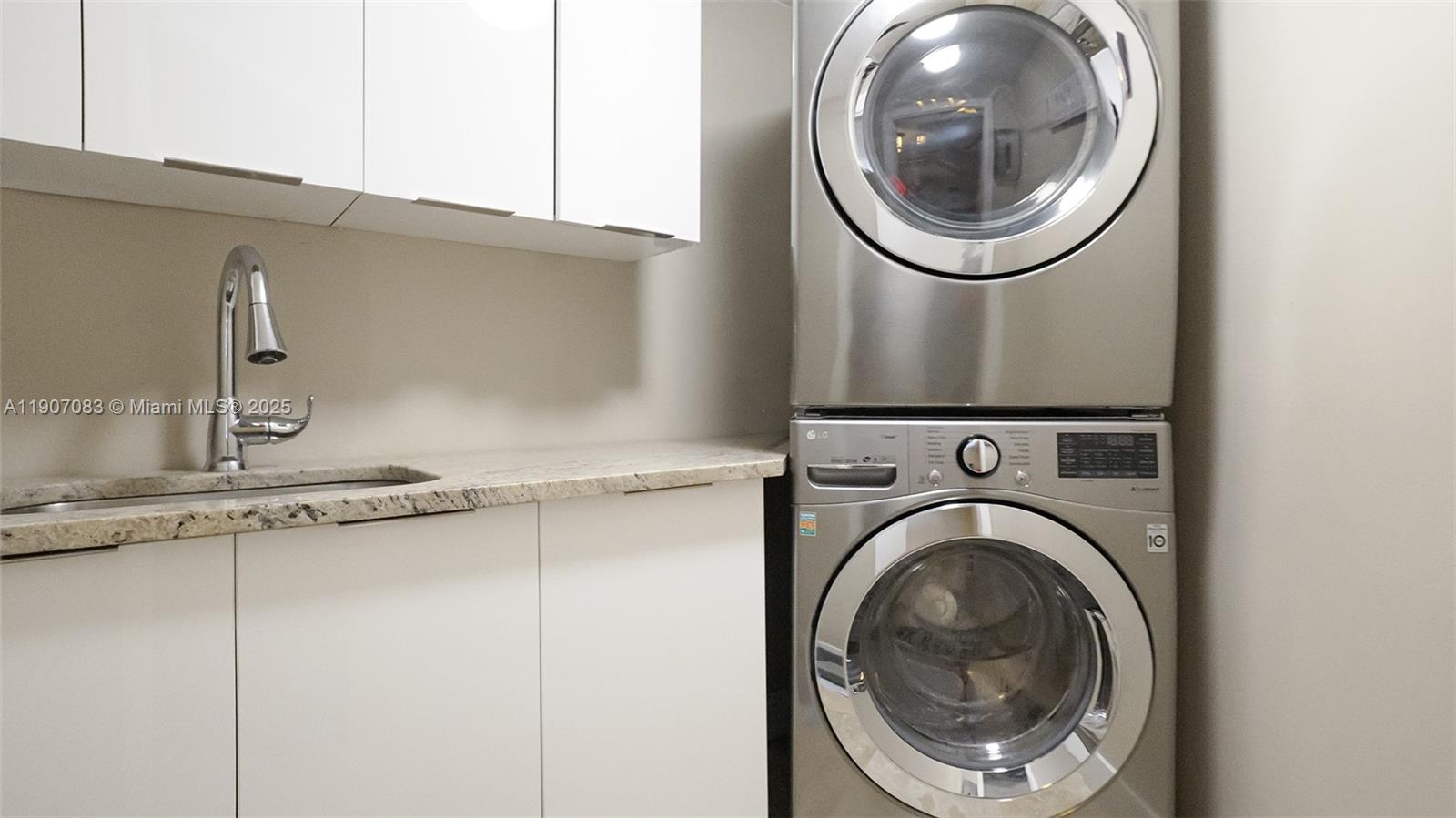 8025 Southwest 91 Avenue Miami, FL 33173 - Photo 49 of 51 a close view of a utility room with dryer and washer
