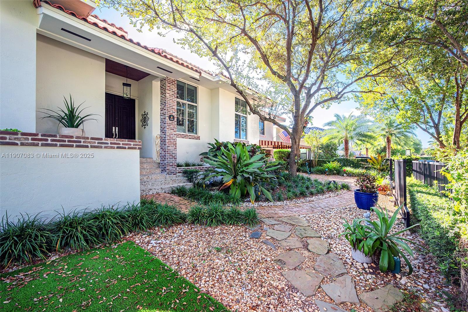 8025 Southwest 91 Avenue Miami, FL 33173 - Photo 5 of 51 a view of a yard with plants and large trees
