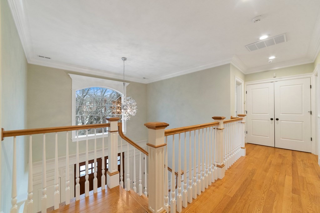 106 Pine Street Newton, MA 02465 - Photo 14 of 22 a view of a livingroom with wooden floor and stairs