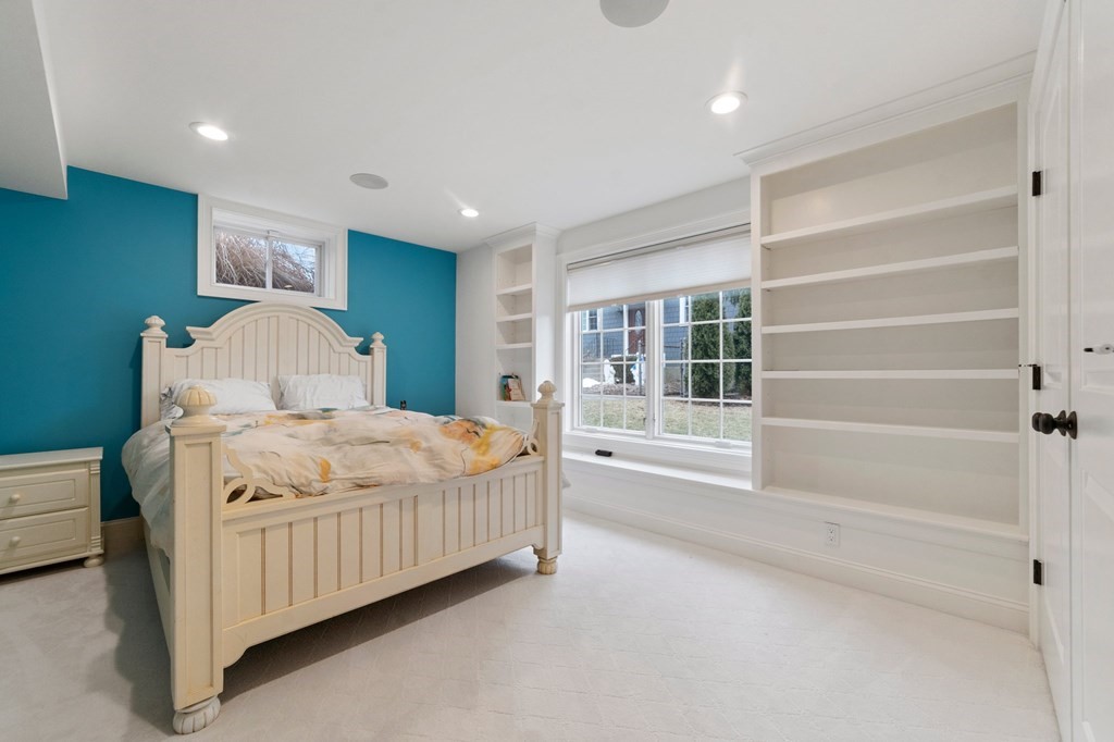 106 Pine Street Newton, MA 02465 - Photo 21 of 22 a bedroom with a large bed and a window
