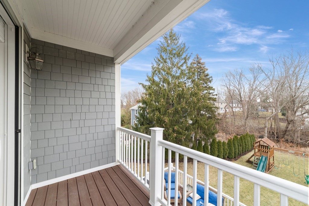 106 Pine Street Newton, MA 02465 - Photo 8 of 22 a view of a balcony with wooden floor and fence