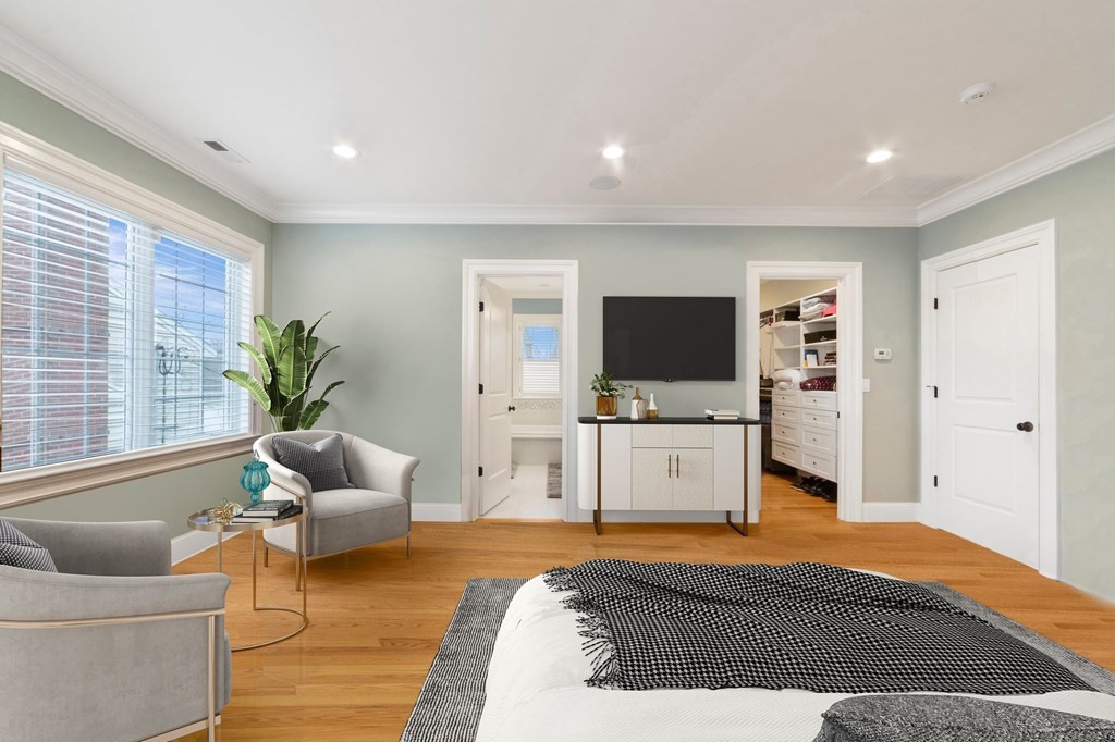 106 Pine Street Newton, MA 02465 - Photo 9 of 22 a spacious bedroom with a bed and a flat screen tv