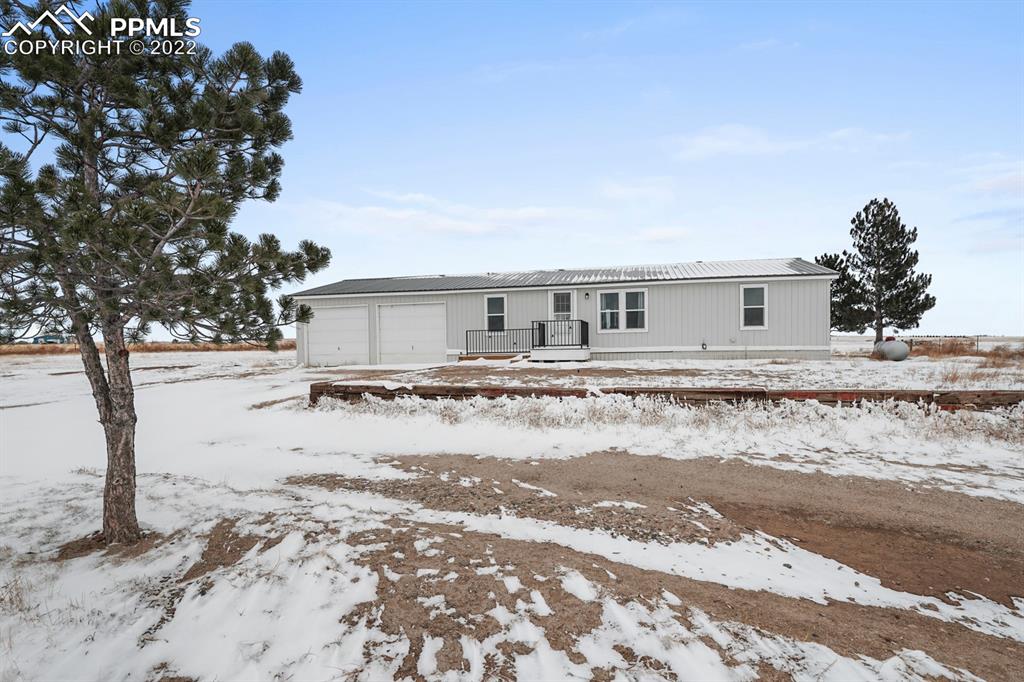 a view of a house with a snow