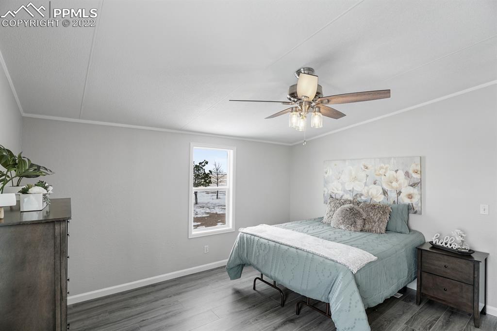 34010 Sanborn Road Yoder, CO 80864 - Photo 14 of 35 a bedroom with a bed and a window