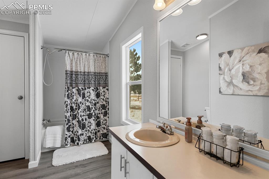 34010 Sanborn Road Yoder, CO 80864 - Photo 16 of 35 a bathroom with a sink and a window