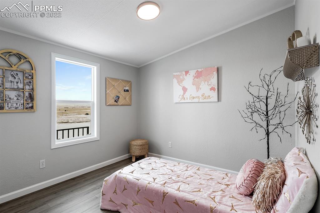 34010 Sanborn Road Yoder, CO 80864 - Photo 19 of 35 a bedroom with a bed and a window