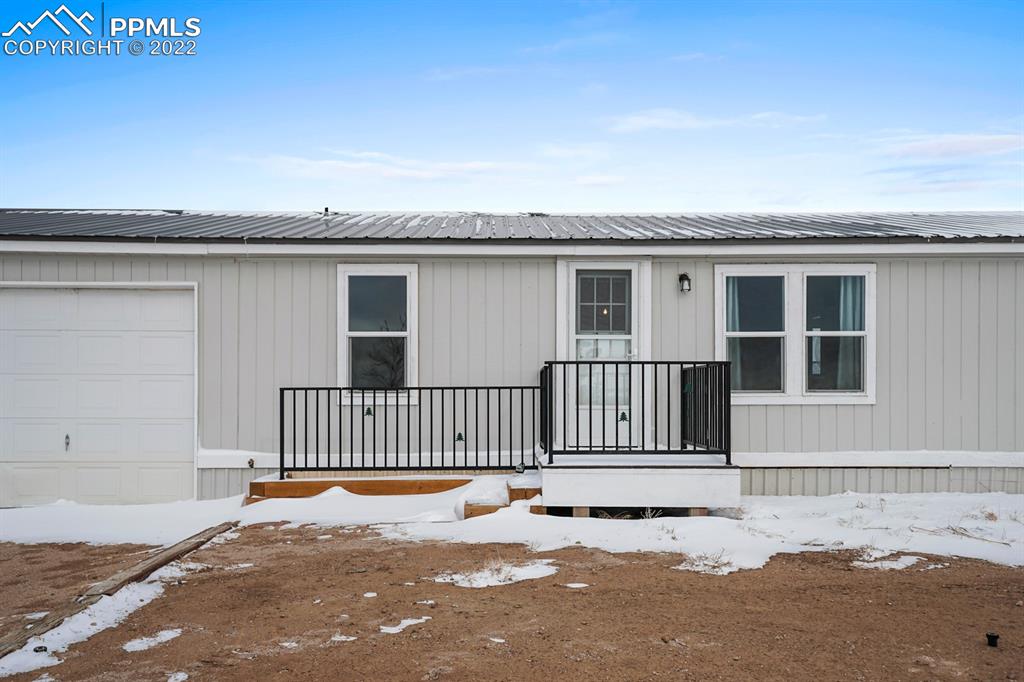 34010 Sanborn Road Yoder, CO 80864 - Photo 2 of 35 a view of a house with a wooden fence
