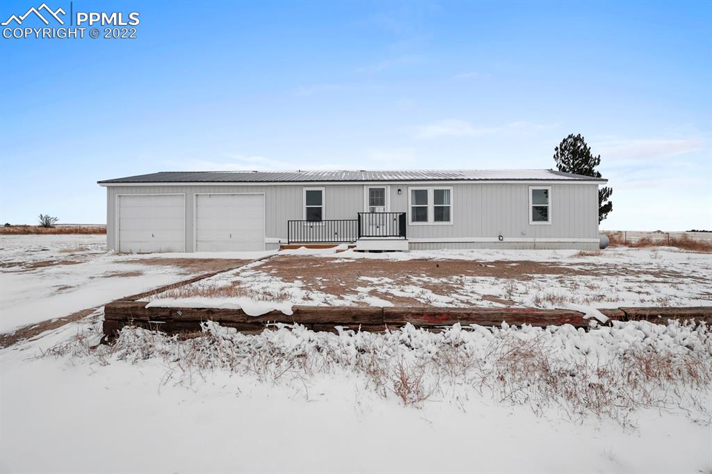34010 Sanborn Road Yoder, CO 80864 - Photo 27 of 35 a view of a house with a big yard