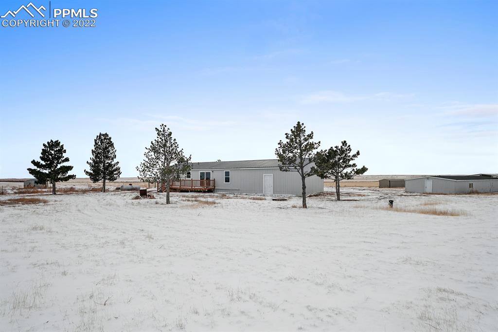34010 Sanborn Road Yoder, CO 80864 - Photo 29 of 35 a view of a house with a snow on the road