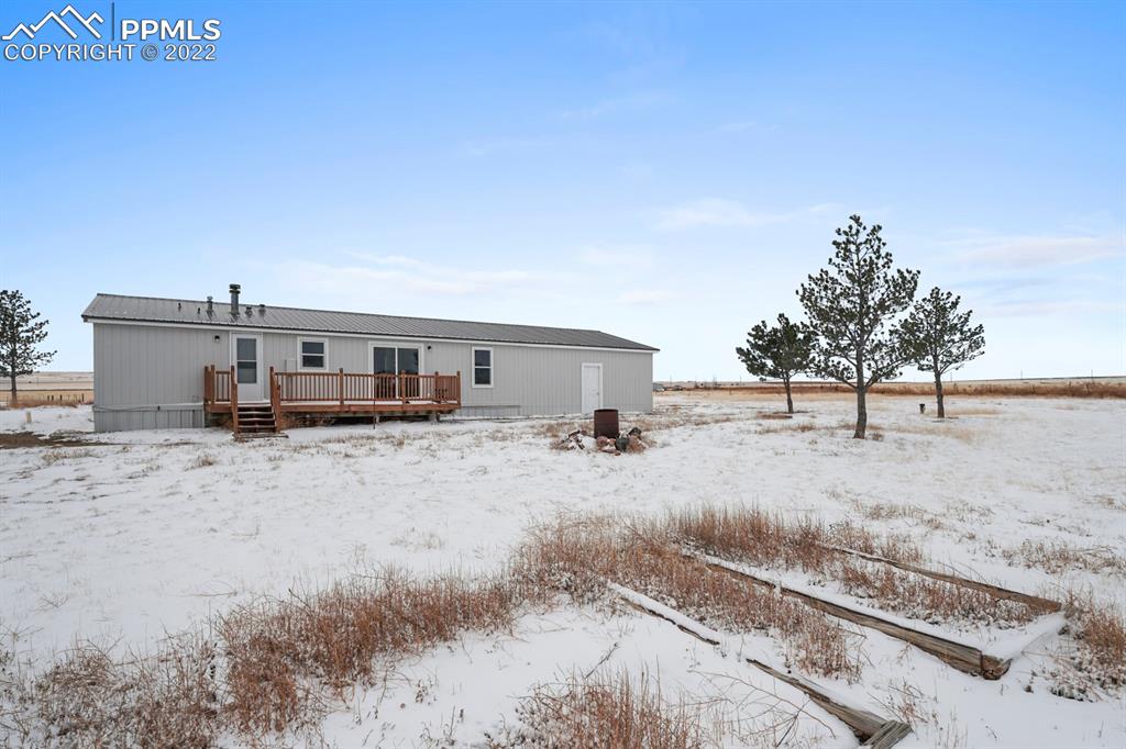 34010 Sanborn Road Yoder, CO 80864 - Photo 30 of 35 a view of a dirt road and a building
