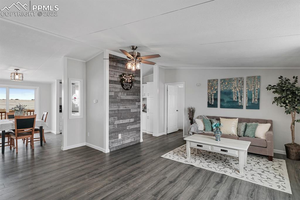 34010 Sanborn Road Yoder, CO 80864 - Photo 3 of 35 a living room with furniture and wooden floor