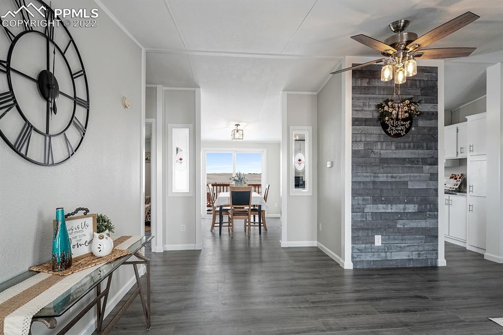 34010 Sanborn Road Yoder, CO 80864 - Photo 6 of 35 a view of a livingroom with furniture and wooden floor