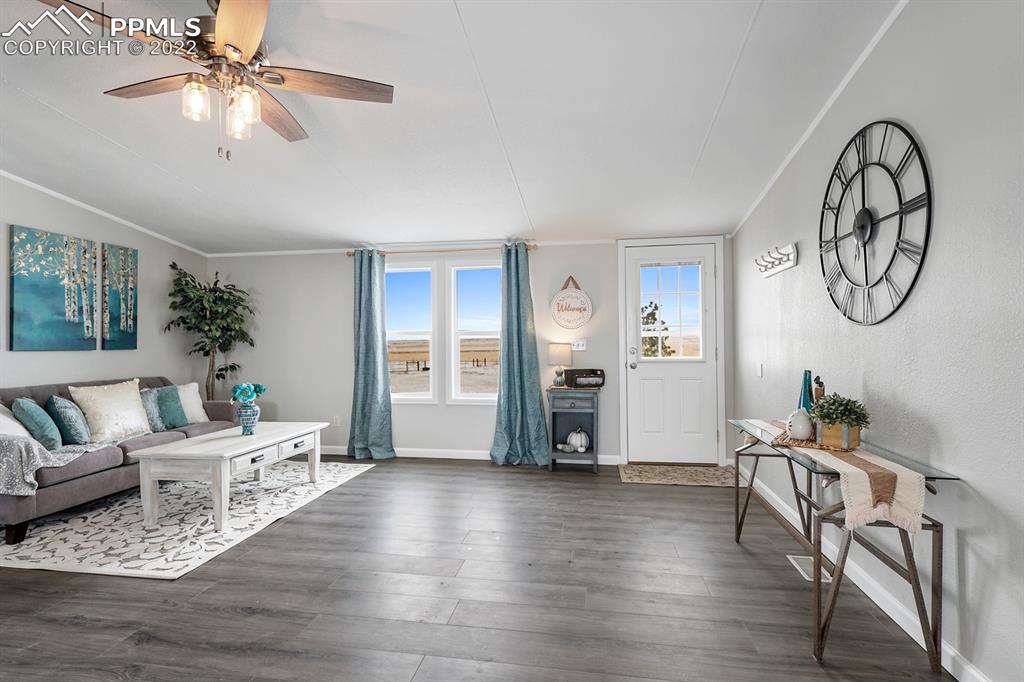 34010 Sanborn Road Yoder, CO 80864 - Photo 7 of 35 a living room with furniture and wooden floor