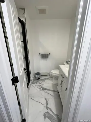 a bathroom with a sink and toilet