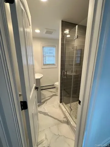 a bathroom with a sink and a shower