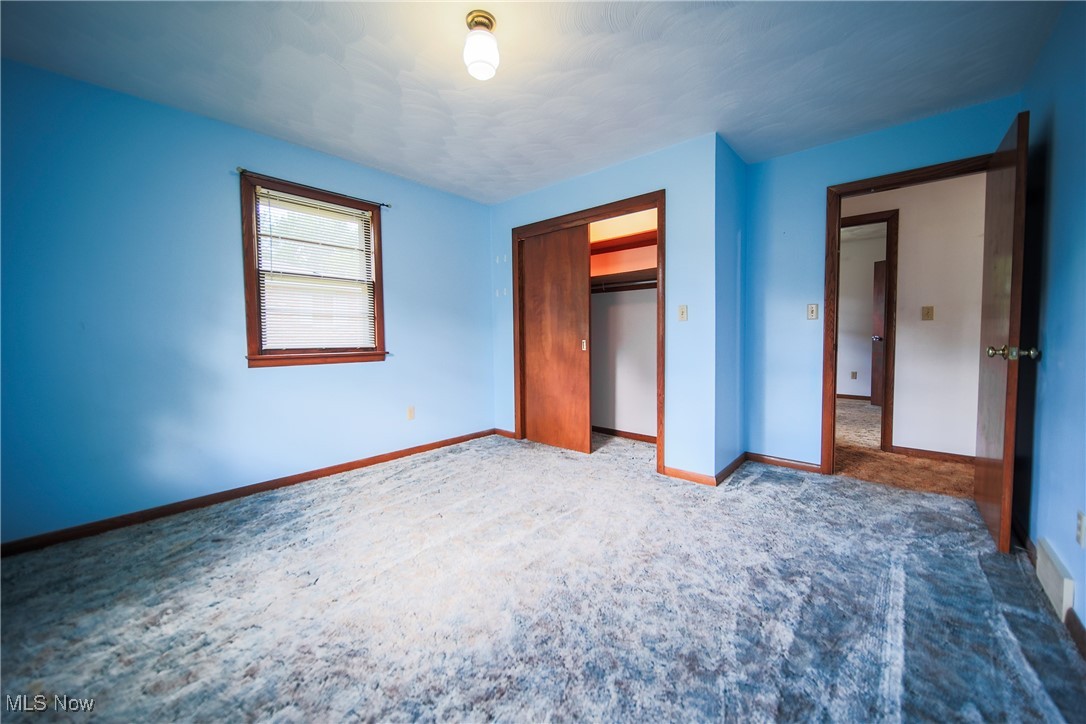 1580 Ruth Drive Wooster, OH 44691 - Photo 22 of 35 Unfurnished bedroom with dark carpet and a closet