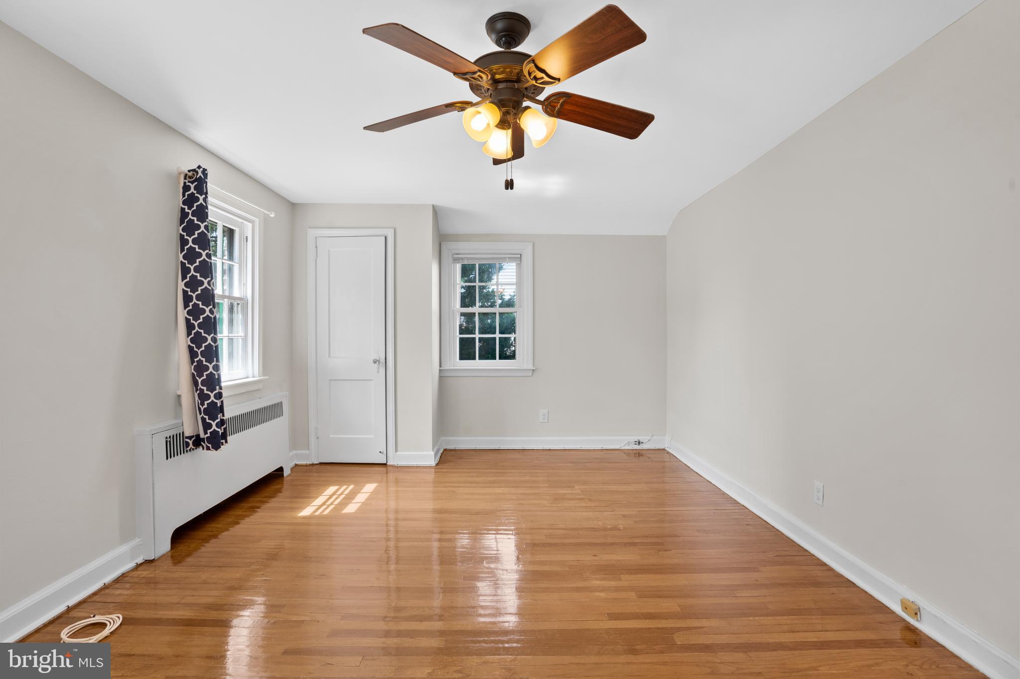806 South Providence Road Wallingford, PA 19086 - Photo 16 of 29 wooden floor in an empty room with a window
