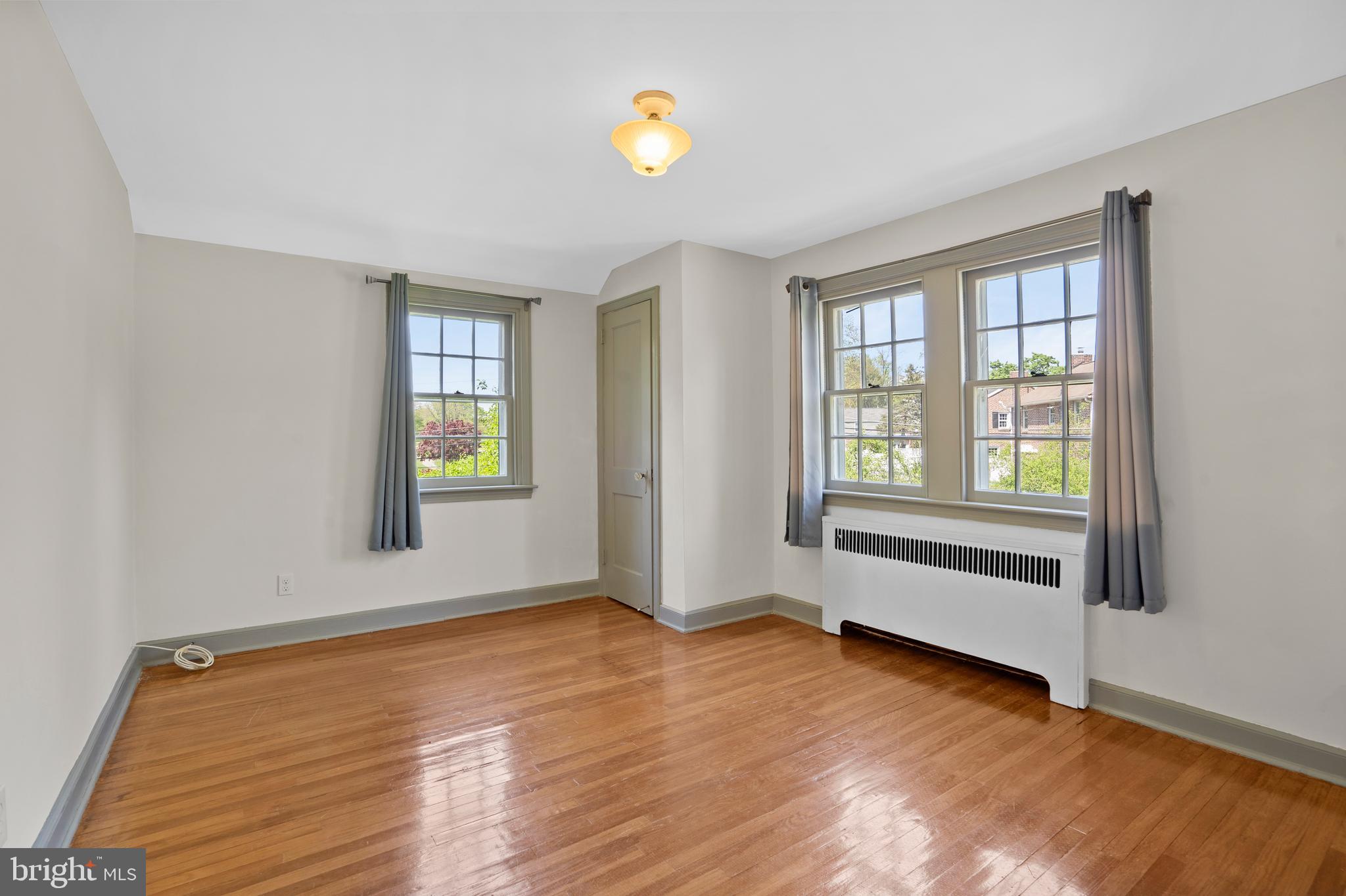 806 South Providence Road Wallingford, PA 19086 - Photo 18 of 29 an empty room with wooden floor and windows