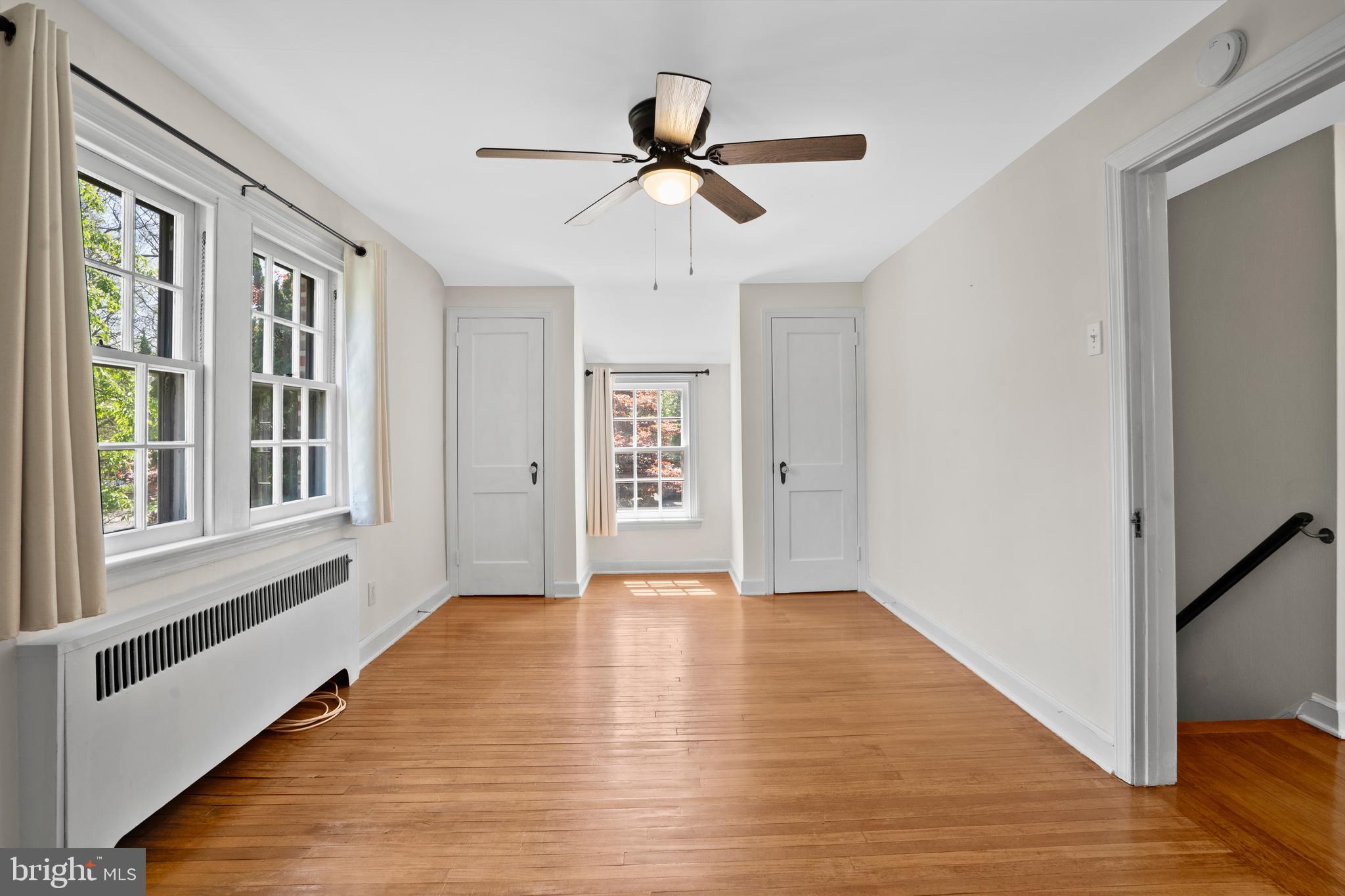 806 South Providence Road Wallingford, PA 19086 - Photo 22 of 29 a view of an empty room with a window and wooden floor