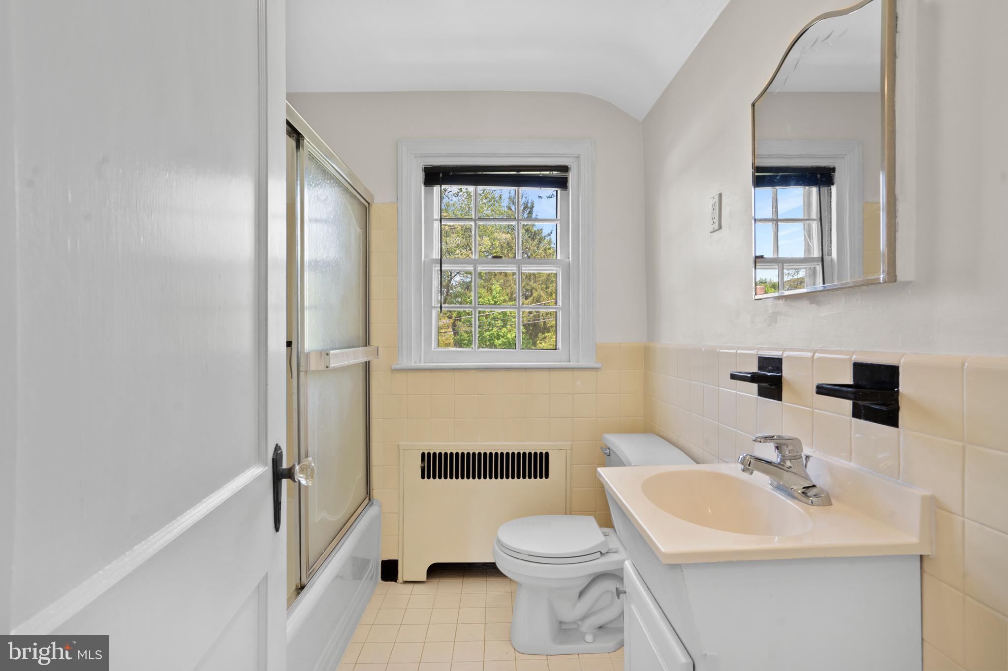 806 South Providence Road Wallingford, PA 19086 - Photo 23 of 29 a bathroom with a toilet a sink and a mirror