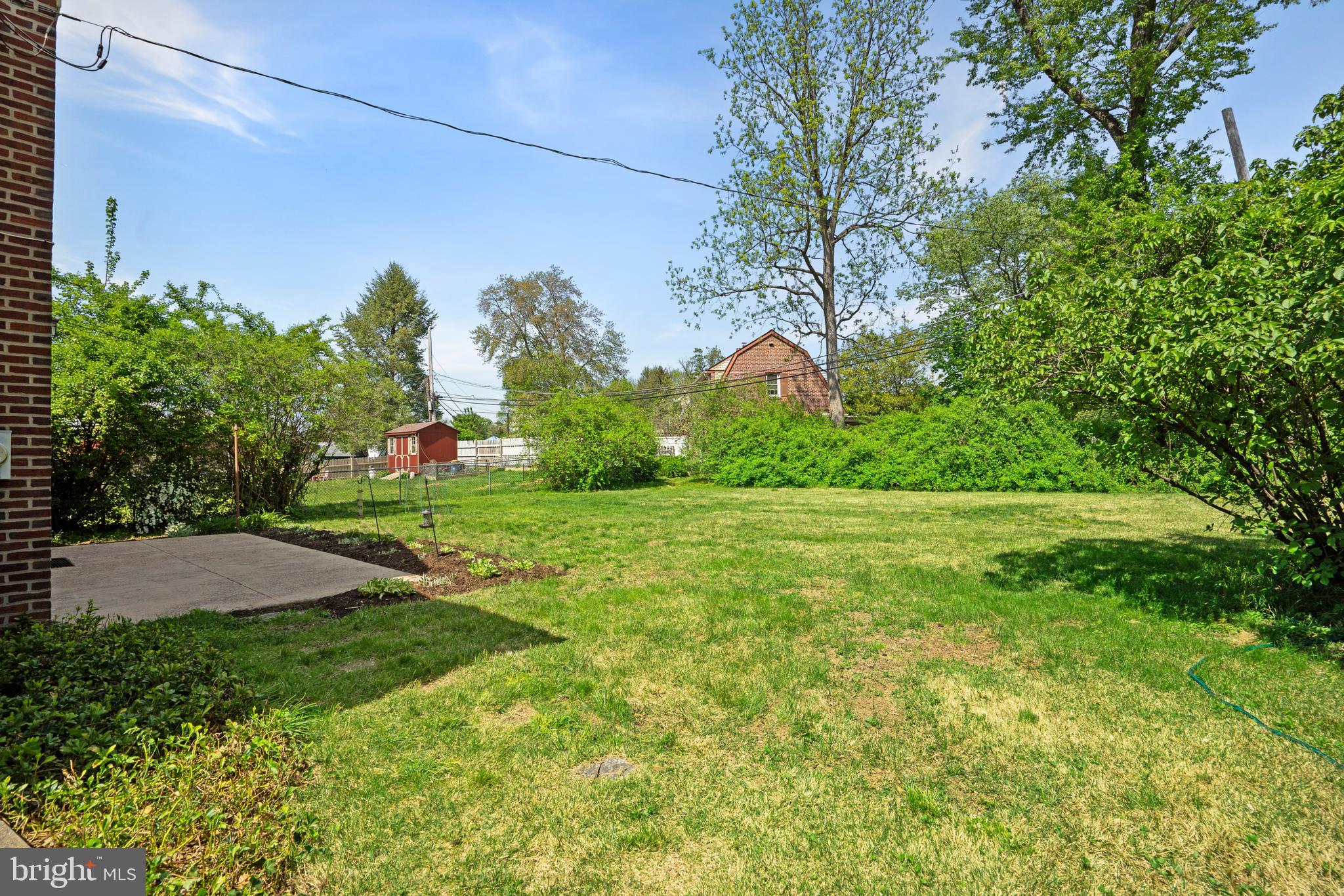 806 South Providence Road Wallingford, PA 19086 - Photo 25 of 29 a backyard of a house with lots of green space
