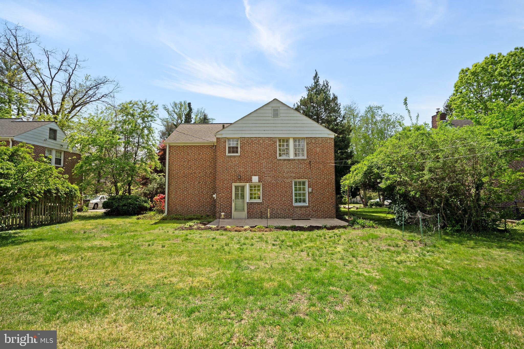 806 South Providence Road Wallingford, PA 19086 - Photo 26 of 29 a large house with a big yard and large trees