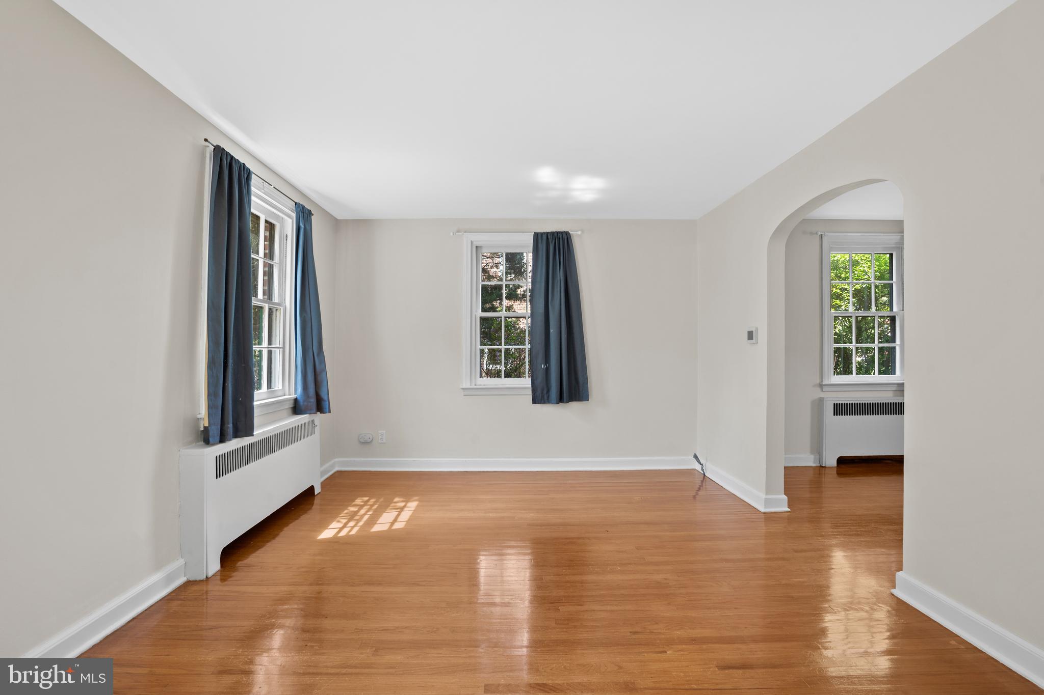 806 South Providence Road Wallingford, PA 19086 - Photo 5 of 29 a view of an empty room with window and wooden floor