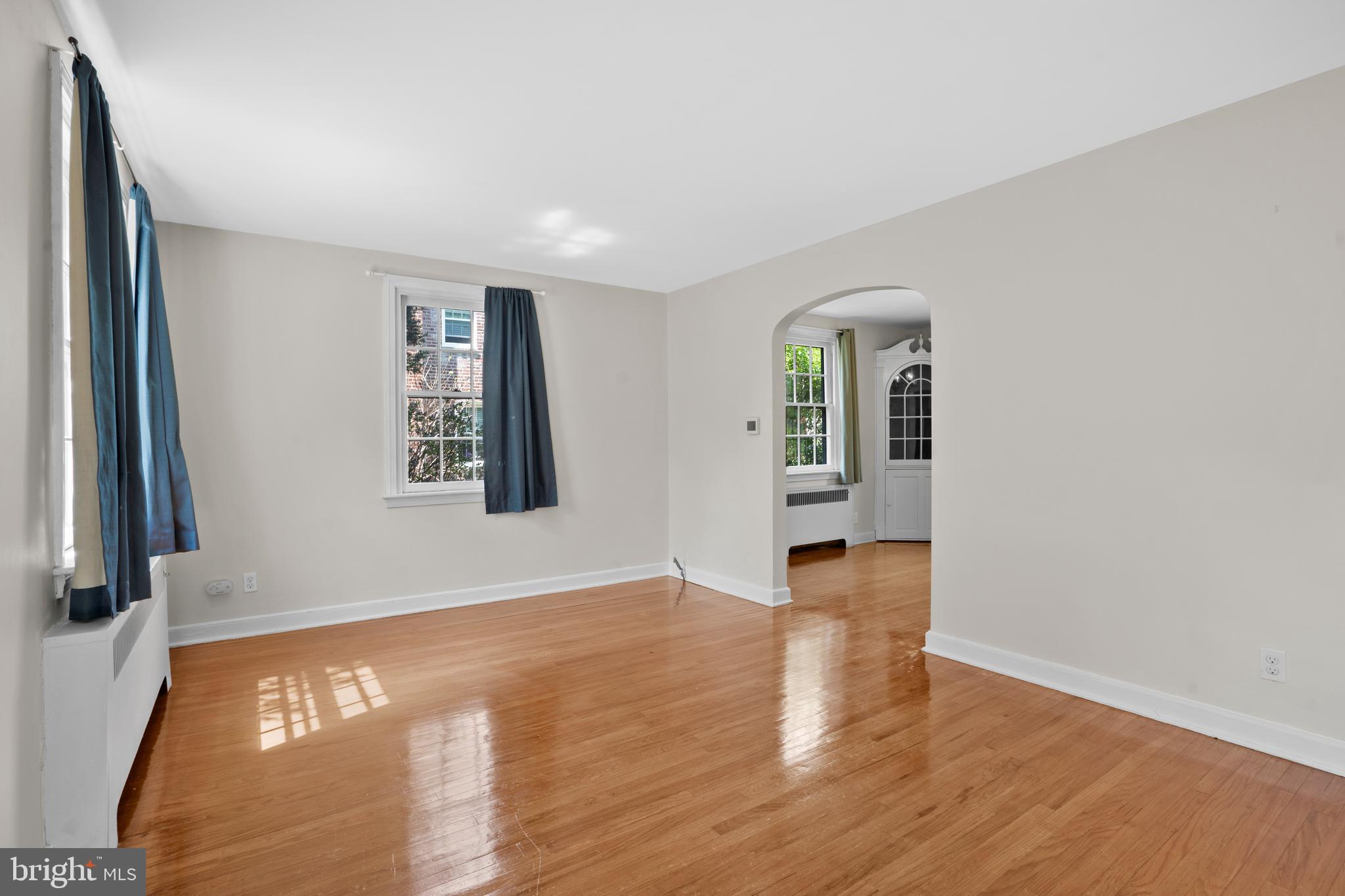 806 South Providence Road Wallingford, PA 19086 - Photo 6 of 29 a view of an empty room with wooden floor and a window