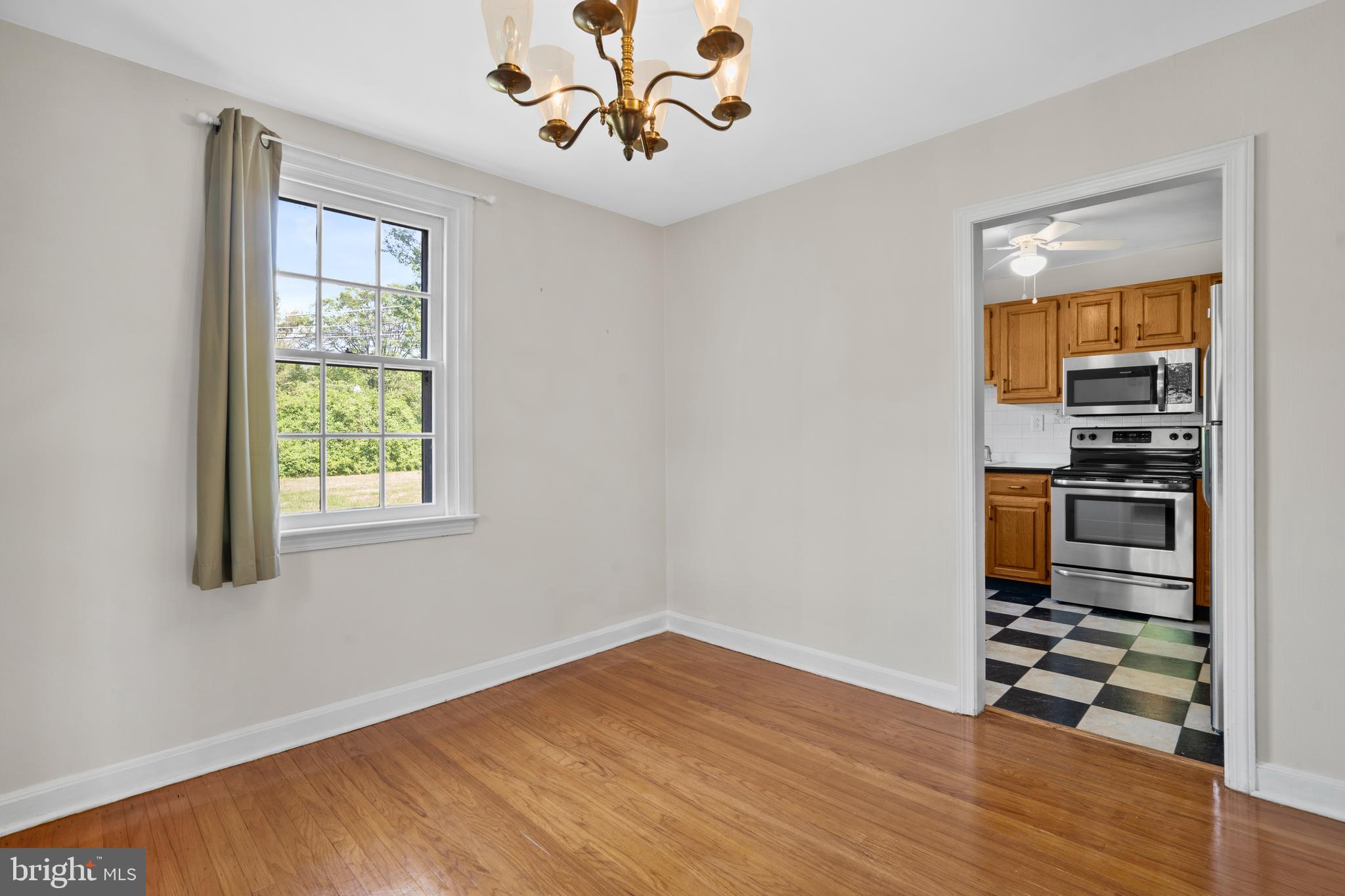 806 South Providence Road Wallingford, PA 19086 - Photo 8 of 29 a view of kitchen with wooden floor electronic appliances and window