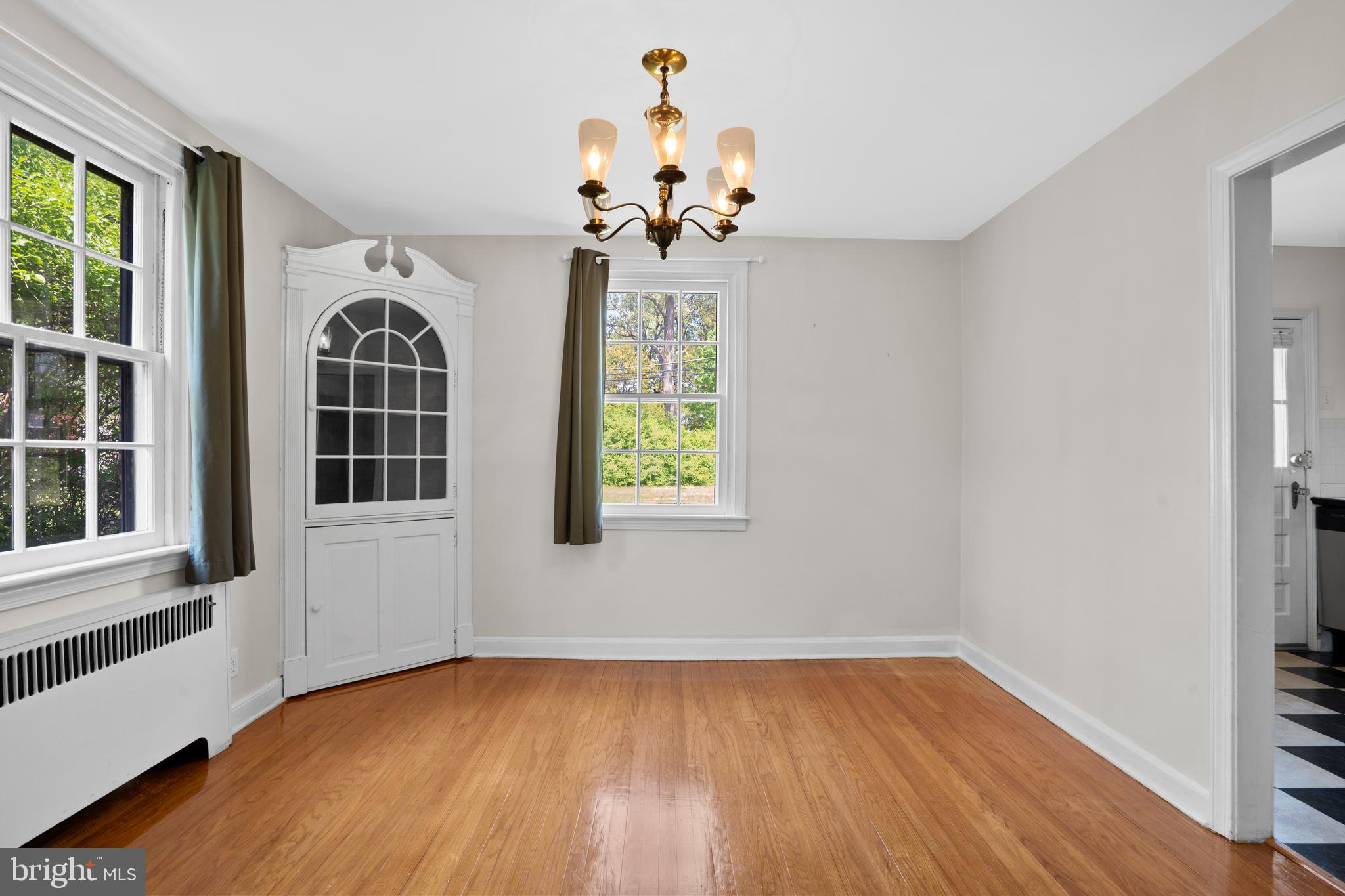 806 South Providence Road Wallingford, PA 19086 - Photo 9 of 29 a view of an empty room with a window and wooden floor