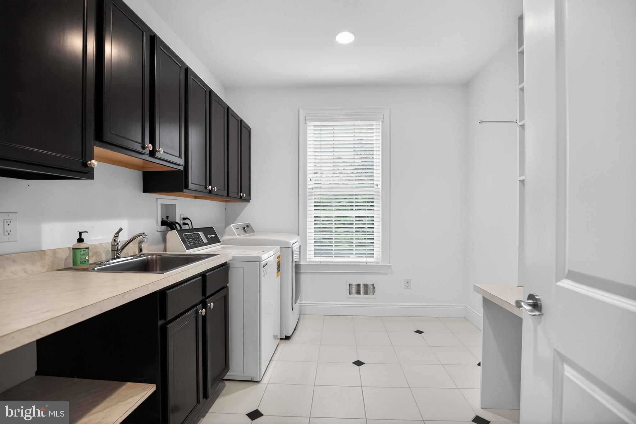 1031 Coates Road Jenkintown, PA 19046 - Photo 40 of 66 a kitchen with a sink cabinets and window