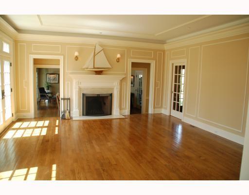 11 Indian Point Lane Riverside, CT 06878 - Photo 13 of 20 a view of an empty room with wooden floor and a fireplace